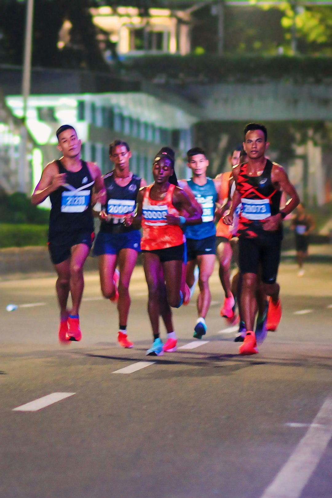 Running crew moving together through a city street