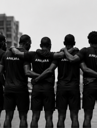 Ankara volunteer holding a branded running shirt